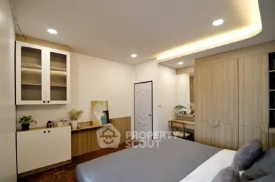 Modern bedroom with stylish wooden furniture and cozy lighting