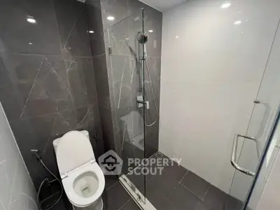 Modern bathroom with sleek shower and elegant tile design