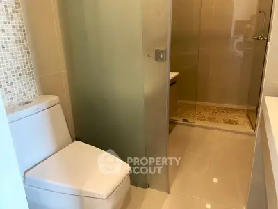 Modern bathroom with sleek design and glass shower enclosure