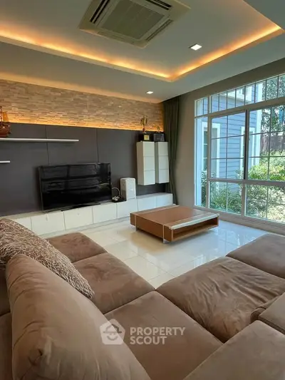 Modern living room with large windows and stylish decor