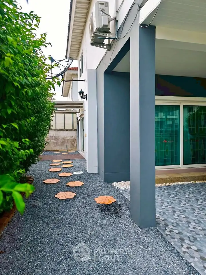 Charming exterior walkway with modern design and lush greenery