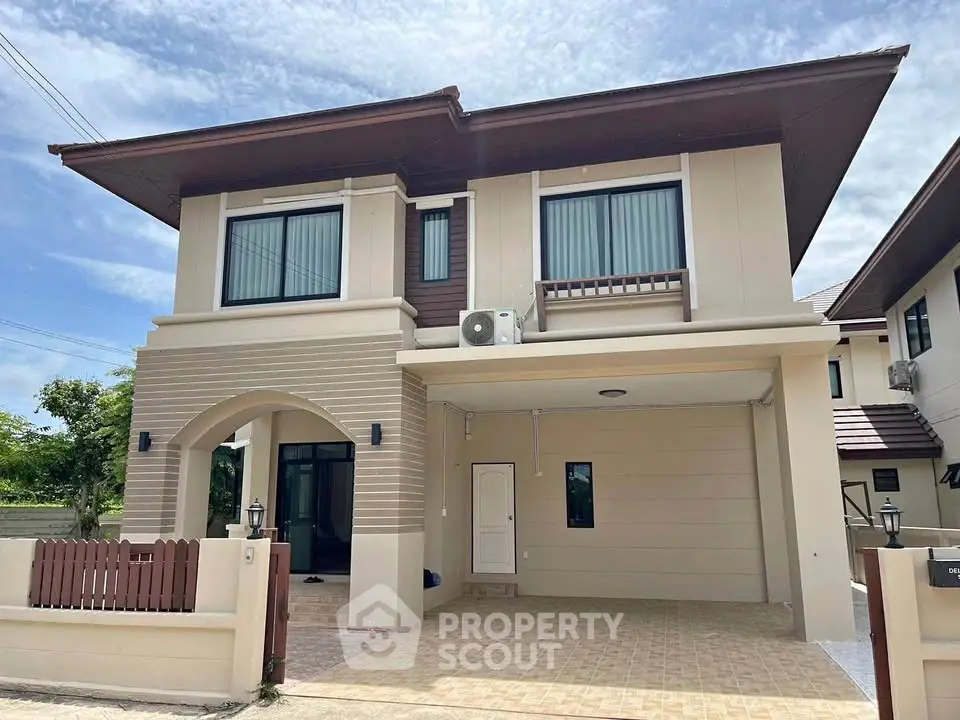 Elegant two-story house with modern design and spacious driveway in a serene neighborhood.