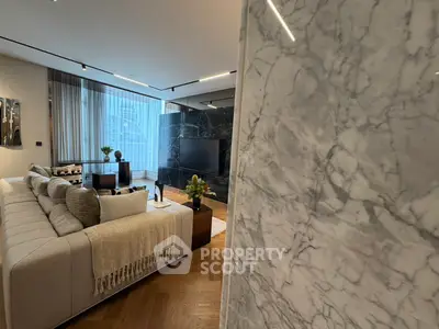 Luxurious modern living room with elegant marble accents and stylish decor