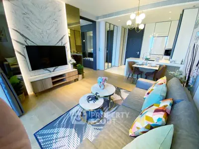 Modern living room with stylish decor and open layout, featuring a cozy seating area and elegant dining space.