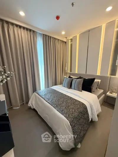 Modern bedroom with elegant decor and ambient lighting