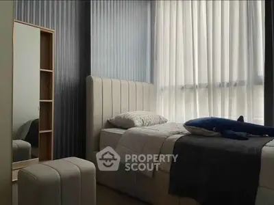 Cozy bedroom with modern decor and natural light