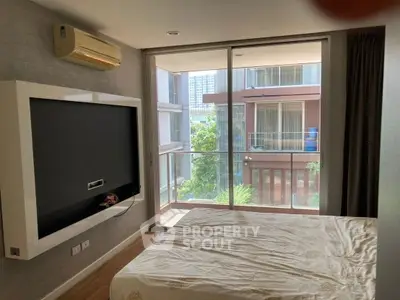 Modern bedroom with balcony view in urban apartment