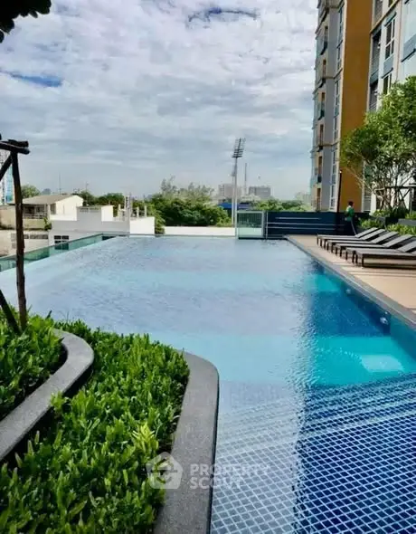 Luxurious rooftop pool with city views and lush greenery