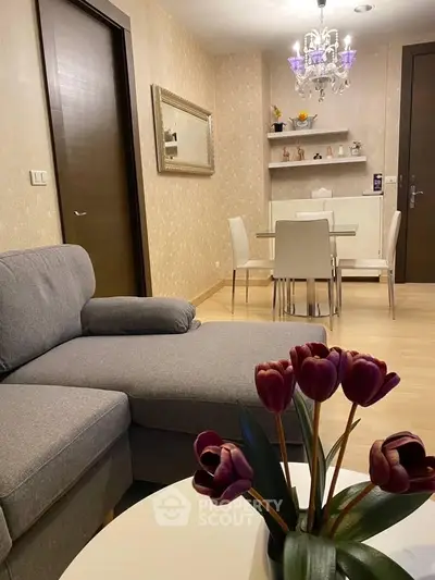 Stylish living room with modern decor and elegant dining area, perfect for urban living.