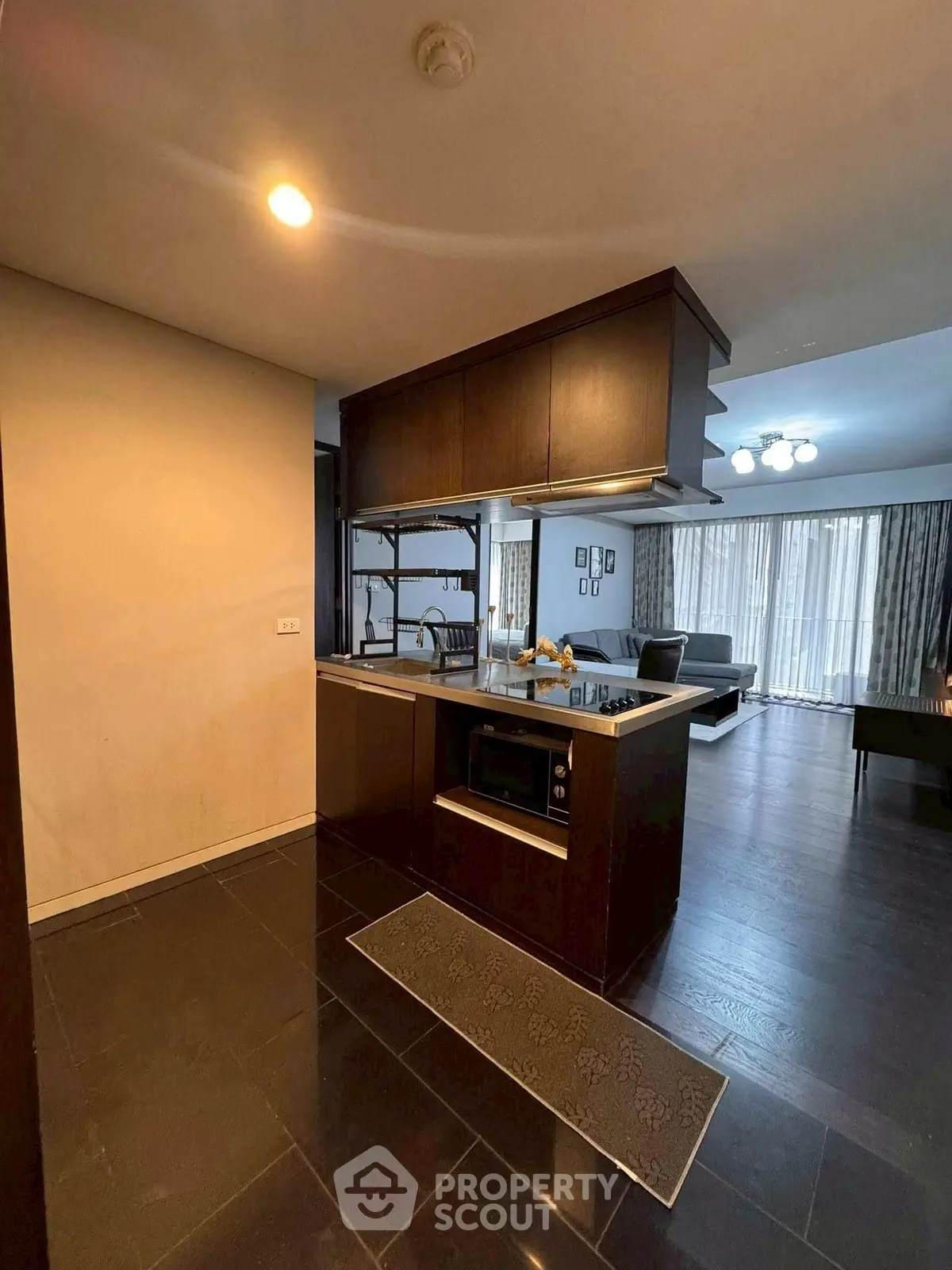 Modern open-layout kitchen with sleek appliances and spacious living area.