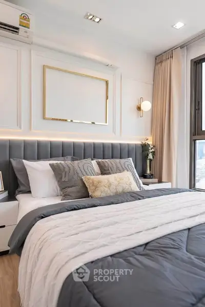 Luxurious modern bedroom with elegant decor and plush bedding