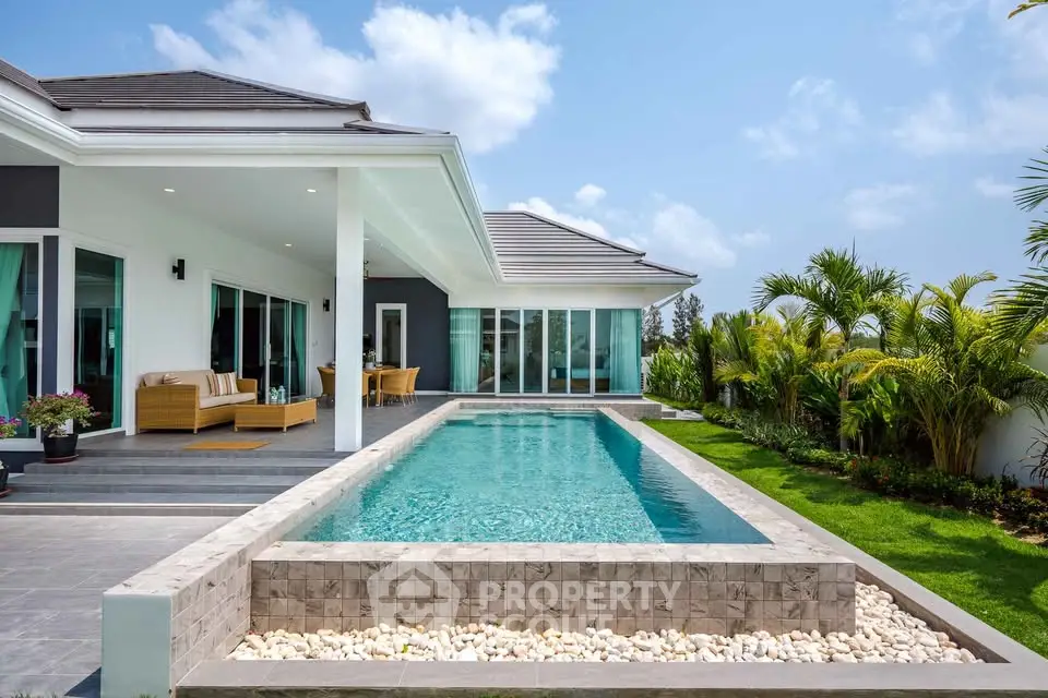 Luxurious modern villa with private pool and lush garden, perfect for relaxation and entertaining.