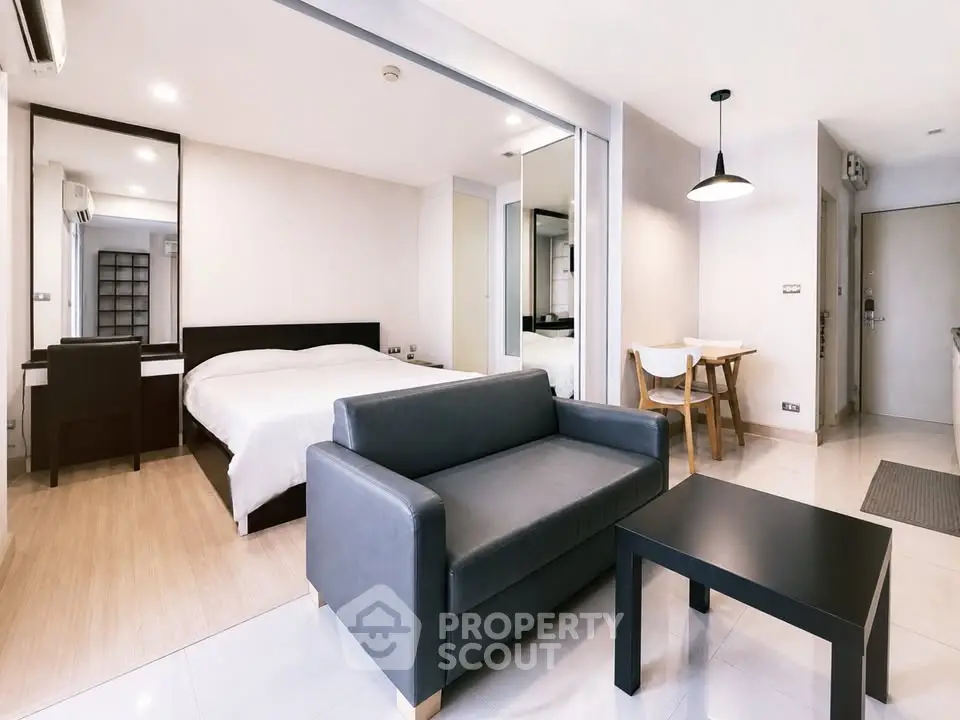 Modern studio apartment with sleek furniture and open layout