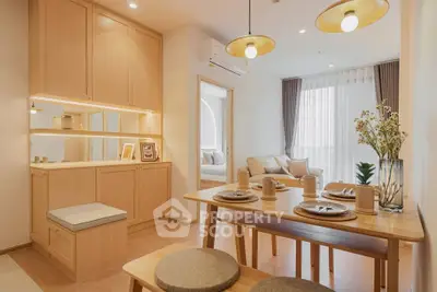 Charming open-plan dining and living area with natural wood finishes and cozy decor.