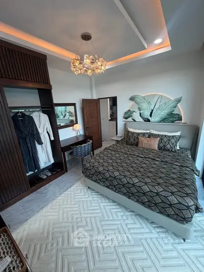 Luxurious bedroom with elegant decor and modern lighting in a stylish apartment.