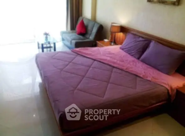 Spacious bedroom with cozy bed and stylish decor