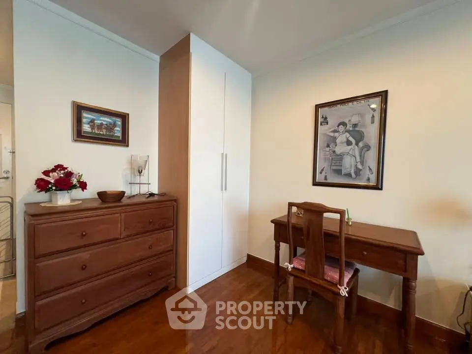 Charming study area with wooden furniture and elegant decor in a cozy home setting.
