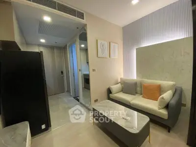 Modern living room with stylish decor and cozy seating area in a contemporary apartment.