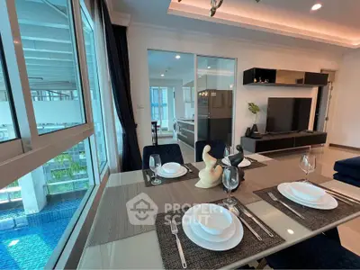 Modern dining area with pool view and elegant table setting