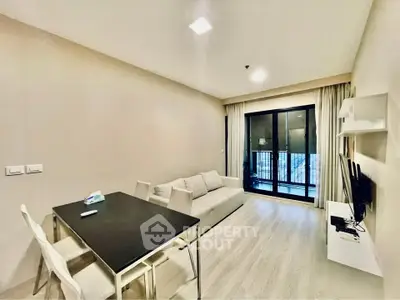 Modern living room with sleek furniture and balcony view