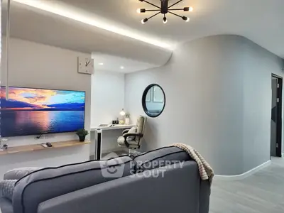 Modern living room with stylish decor and cozy workspace