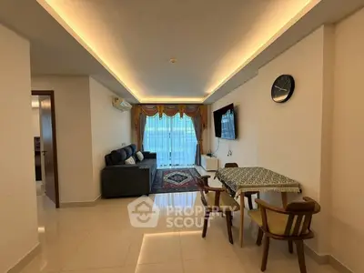 Spacious living room with modern decor and natural light