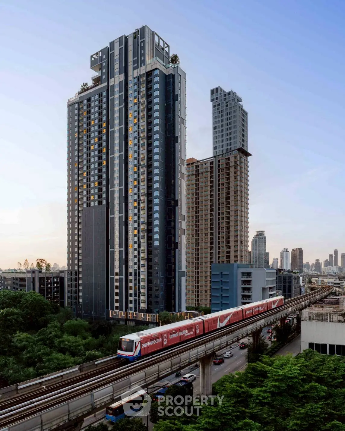 Stunning high-rise building with modern architecture near urban transit line, perfect for city living.