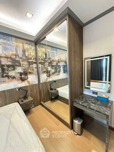 Modern bedroom with mirrored wardrobe and stylish decor