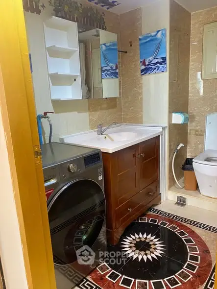 Charming bathroom with modern washer and elegant tile design