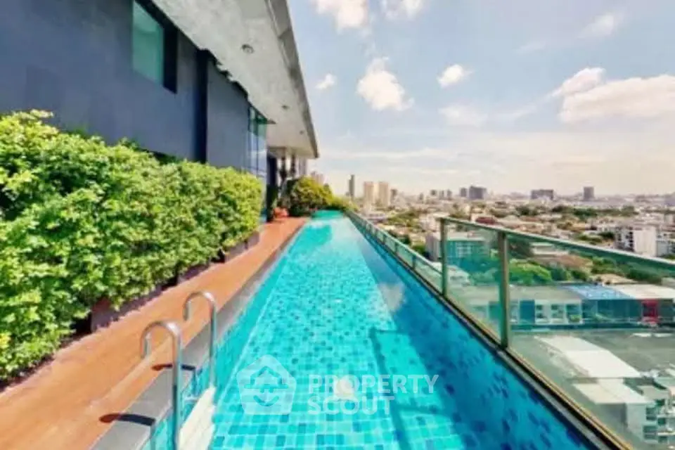Luxurious rooftop pool with stunning city views and lush greenery
