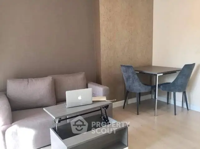 Modern living room with stylish furniture and workspace setup