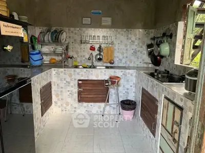 Charming rustic kitchen with open shelving and tiled backsplash, perfect for cozy home cooking.