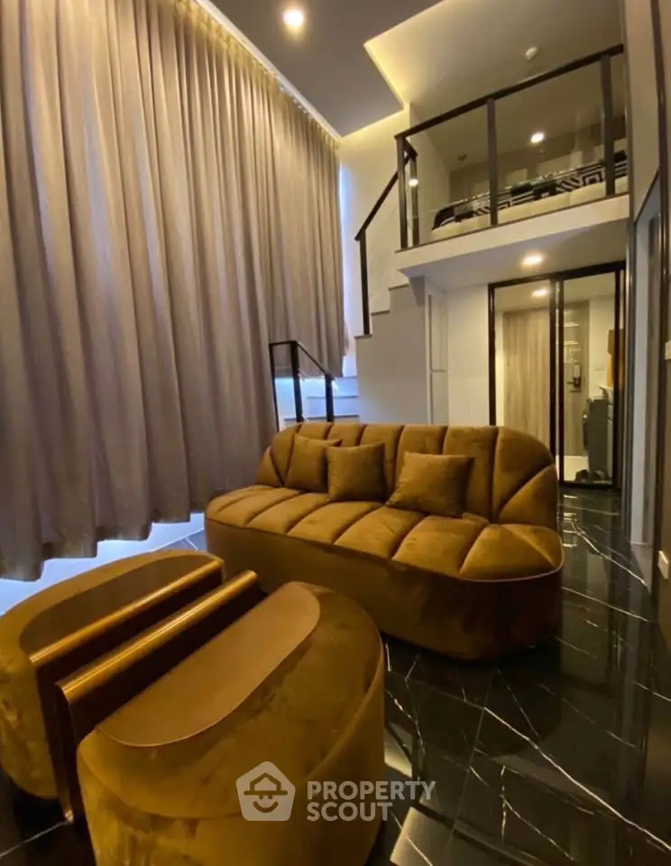 Luxurious loft-style living room with plush seating and modern design