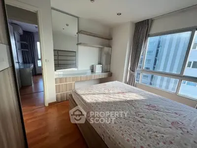 Bright bedroom with large windows and modern decor in urban apartment