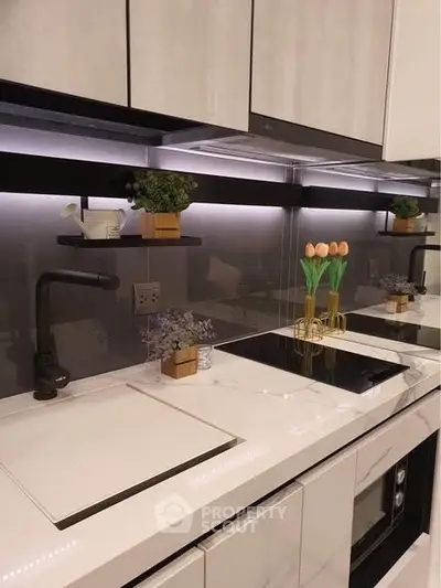 Modern kitchen with sleek countertops and built-in appliances