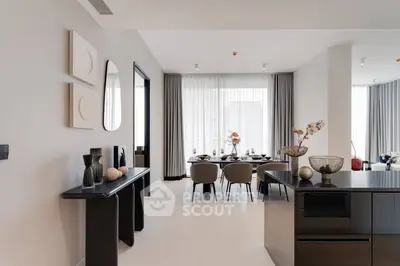 Elegant modern living and dining area with stylish decor and natural light