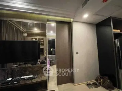 Modern interior with sleek design featuring a TV and stylish decor, perfect for contemporary living.