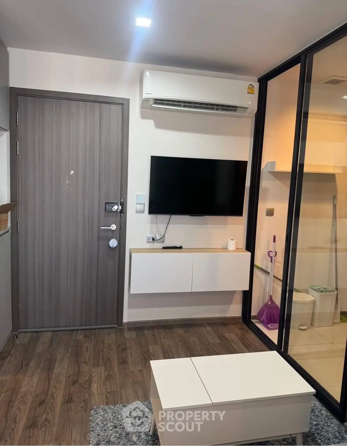 Modern living room with sleek design and air conditioning