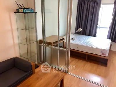 Modern studio apartment with glass partition and wooden flooring
