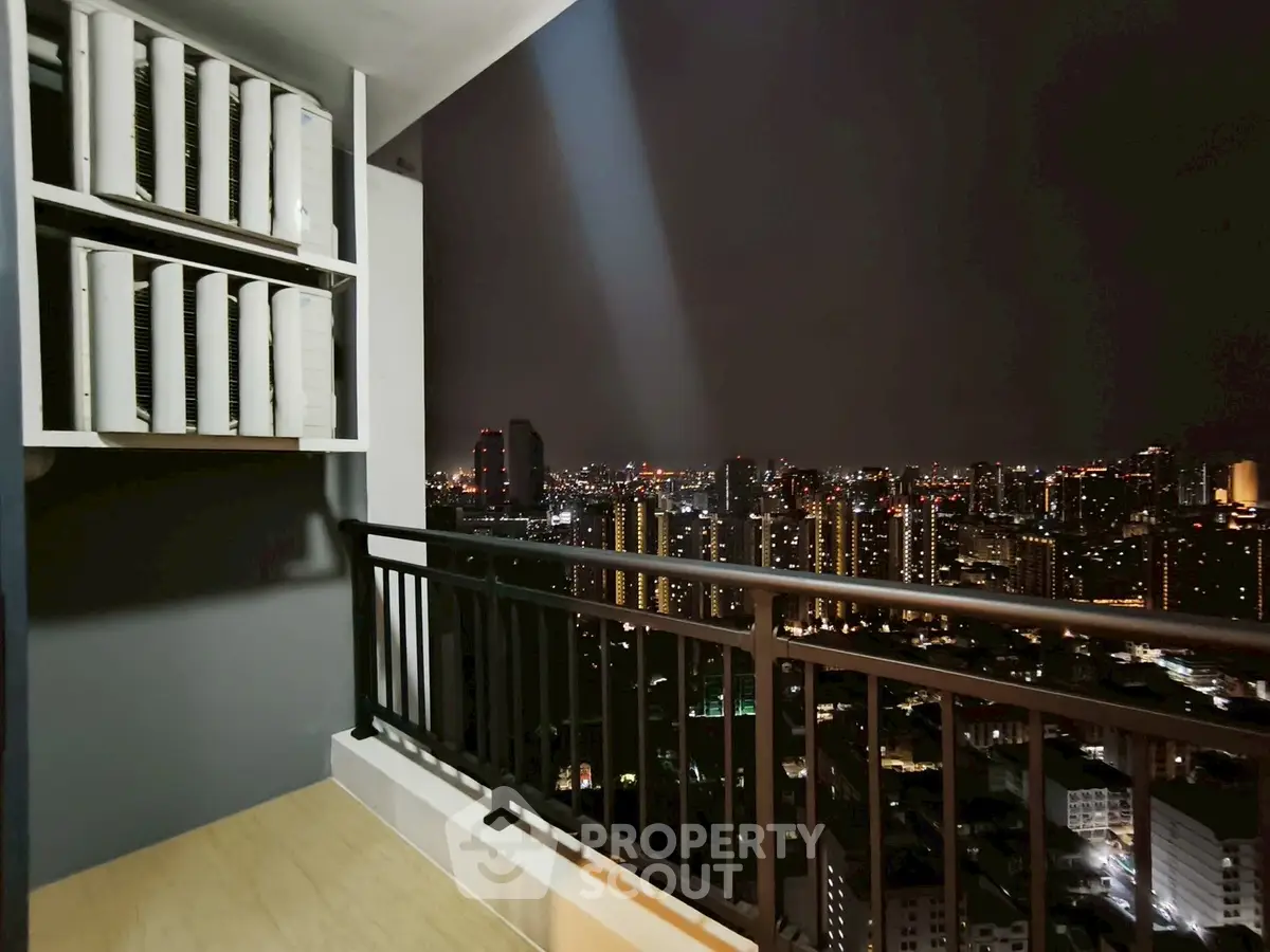 Stunning city skyline view from high-rise balcony at night