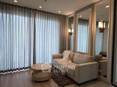 Elegant living room with cozy sofa and stylish decor, perfect for relaxation.