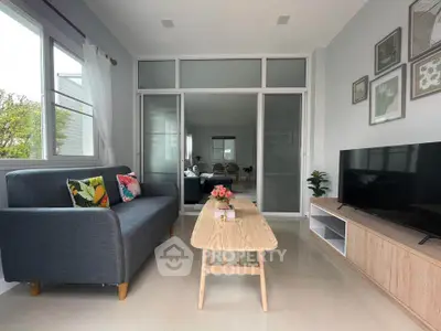 Modern living room with sleek furniture and large windows in a stylish home