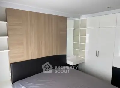 Modern bedroom with sleek design and ample storage space