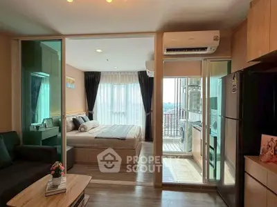 Modern apartment interior with bedroom, living room, and balcony view, featuring sleek design and natural light.