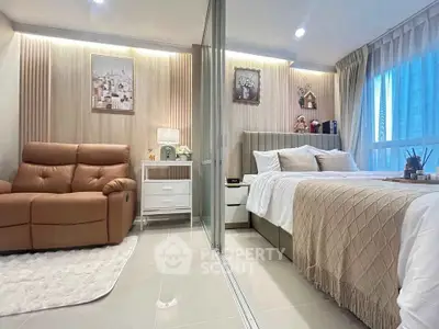 Luxurious modern bedroom with cozy seating area and elegant decor