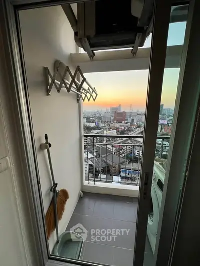 Charming balcony with stunning city view, perfect for relaxing and enjoying sunsets.