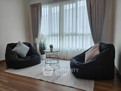 Cozy living room with bean bag chairs and natural light