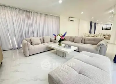 Spacious modern living room with plush sofas and elegant decor