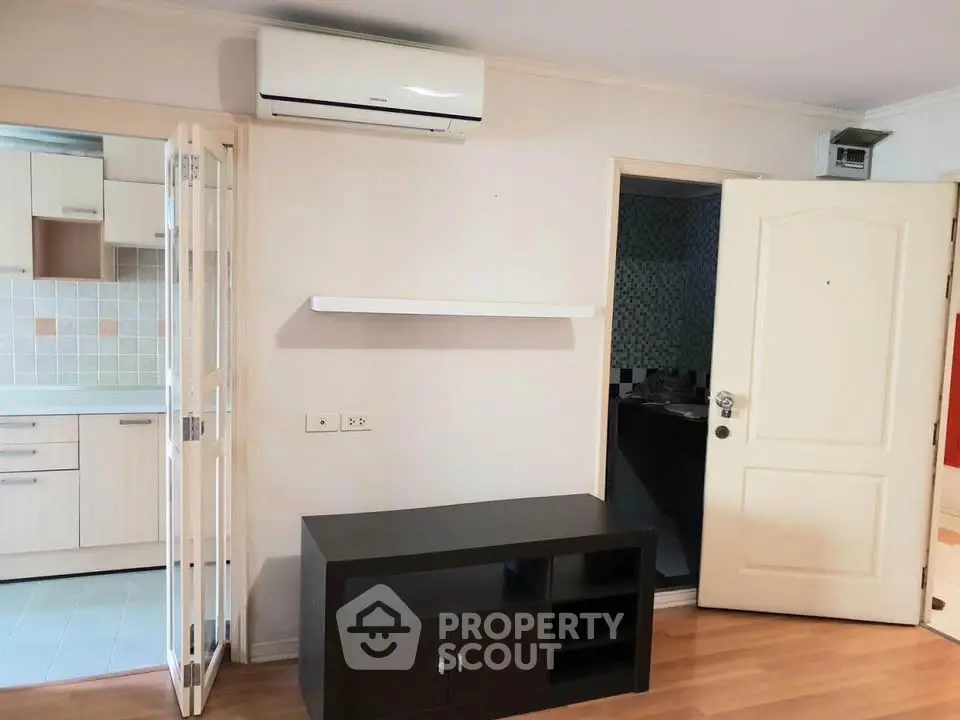 Modern apartment interior with air conditioning and open kitchen layout