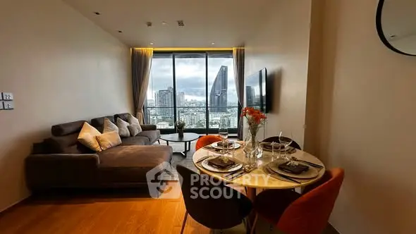 Modern living room with city view, stylish furniture, and elegant dining area in a high-rise apartment.